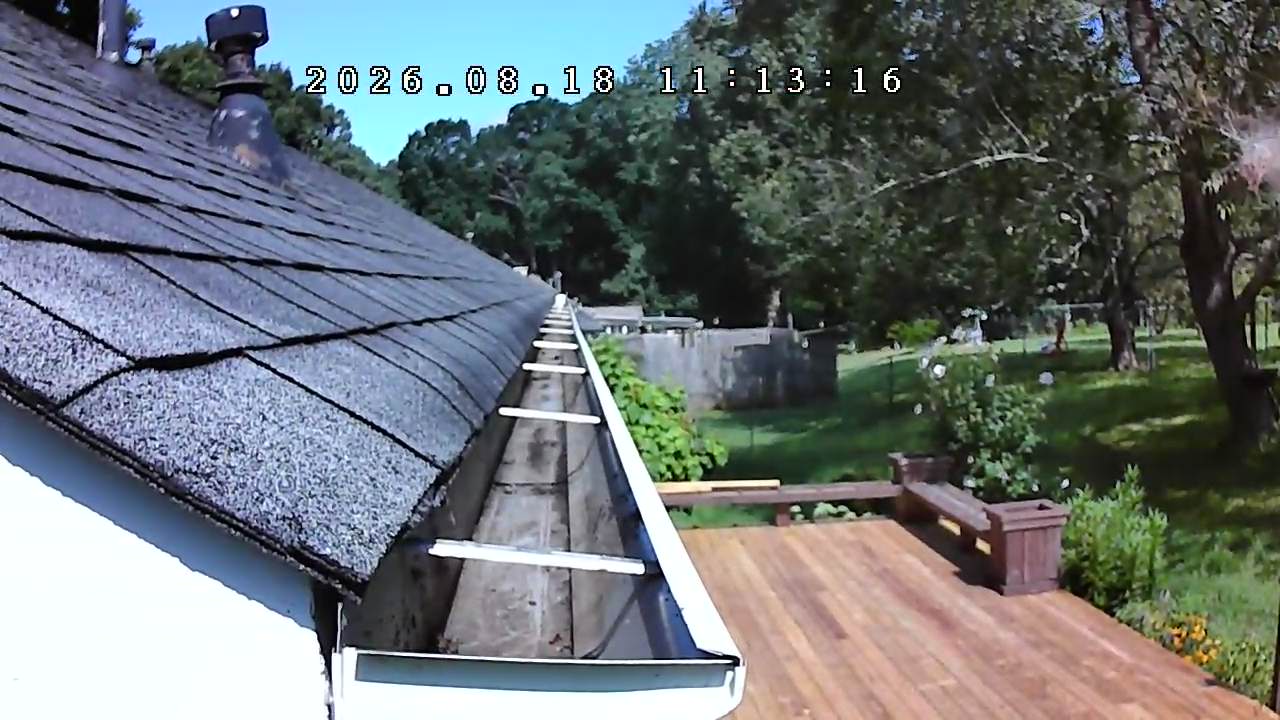 The same gutter completely clear and flowing after professional cleaning in Cumming, Georgia