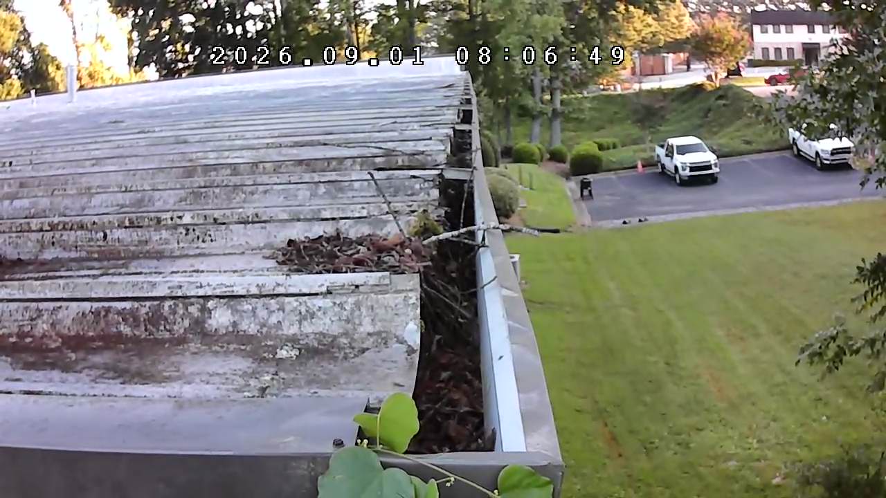 Gutter before cleaning at a commercial property in Cumming, Georgia